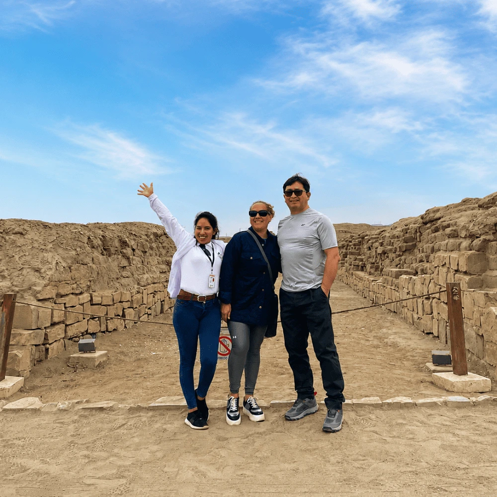 Travelers exploring the stone walls of Pachacamac near Lima