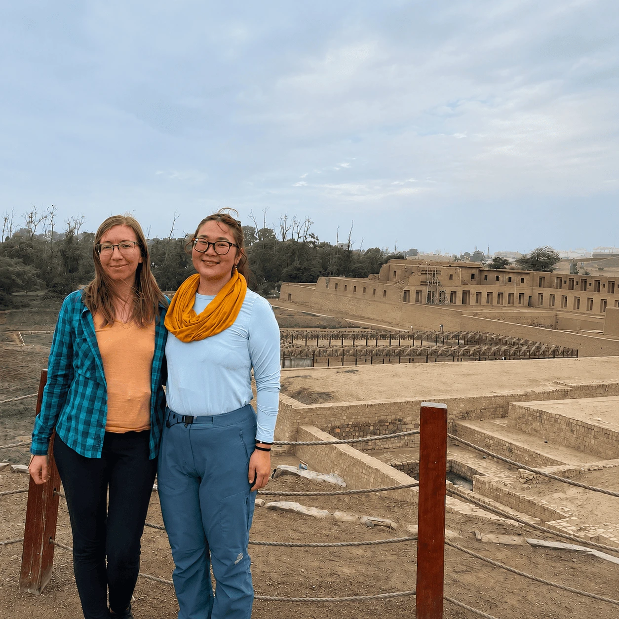 Travelers overlooking the Pachacamac archaeological complex near Lima