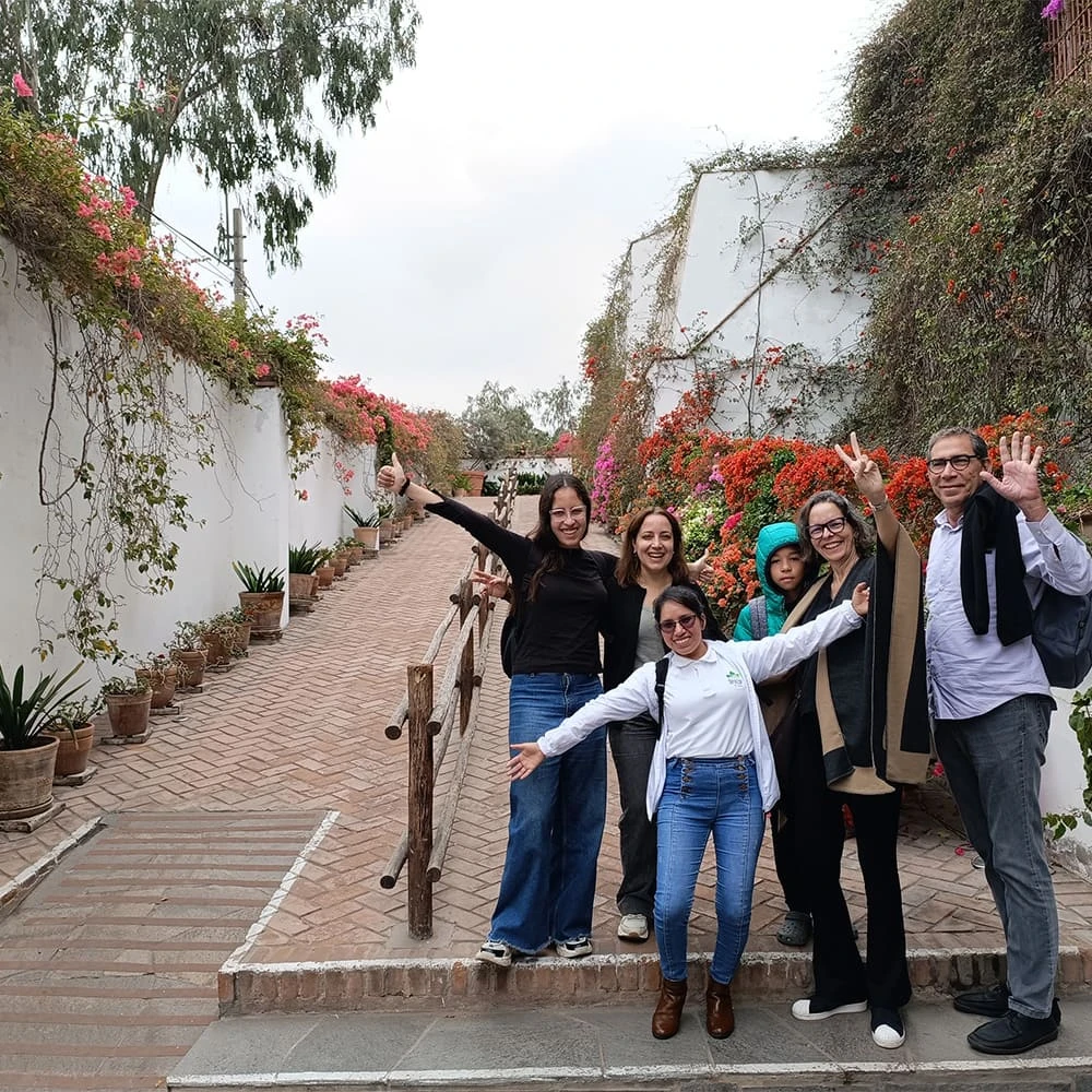 Travelers walking through the gardens of the Larco Museum